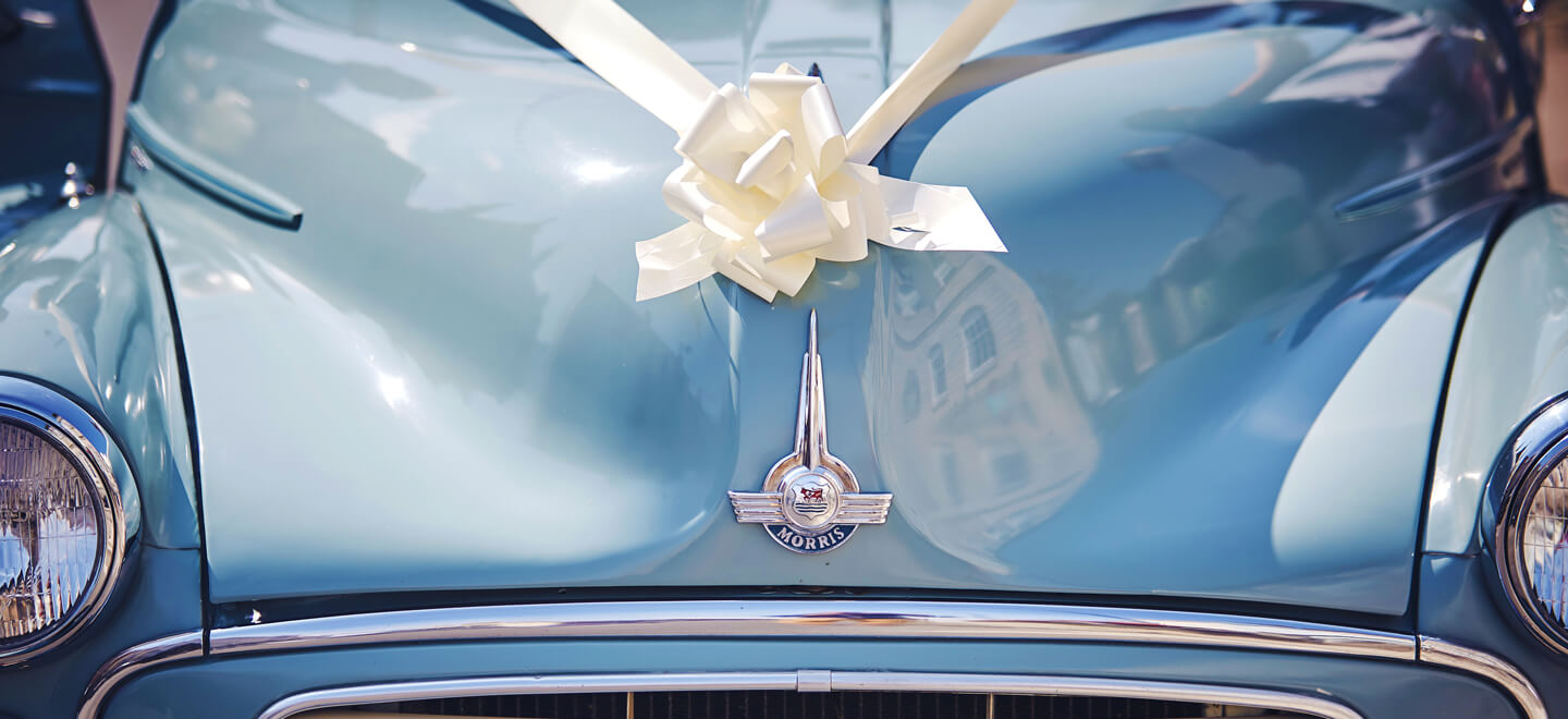 old car with bow for wedding setu ardour and bow from exeter via gay wedding by wedding carby nova photography 6