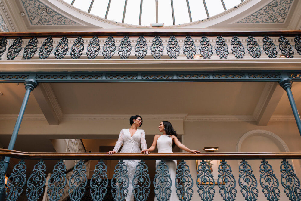 on balcony Suria and Paige lesbian wedding The Grand Brighton image by In Between Days 1 5