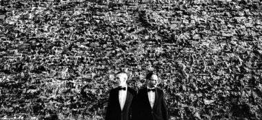 Orchestra Weddings Gay Couple Facing Outwards By A Big Wall 6 380X174