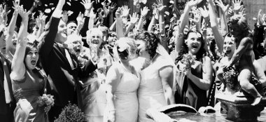 Orchestra Weddings Lesbian Couple Kissing After Getting Married People Cheering 6 380X174