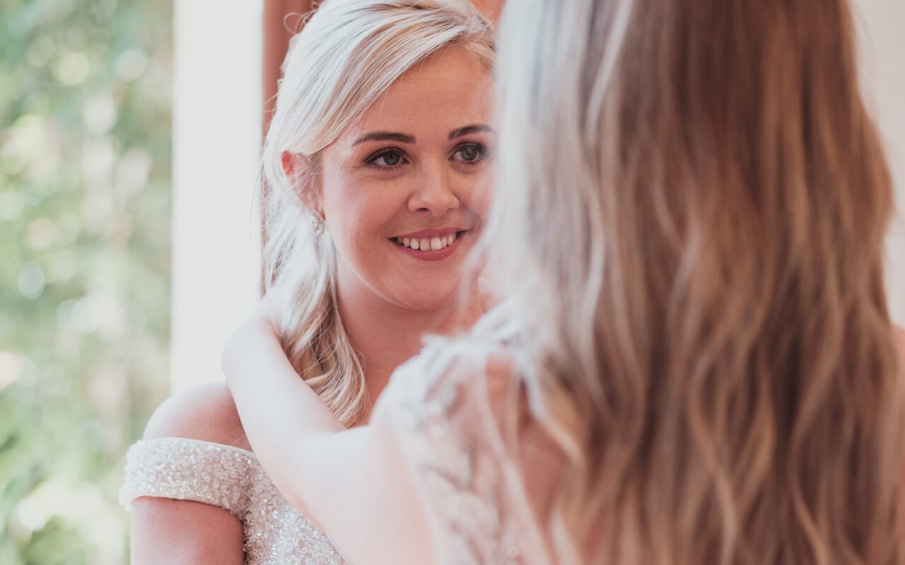 two brides looking in each others eyes and smiling 9