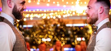 Two Gay Grooms Holding Hands And Declaring Their Love At Oec In Sheffield Via Gay Wedding Guide 9 380X174