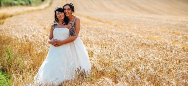 Two Lesbian Brides In The Field At Upcote Barns In Cotswolds Via Gay Wedding Guide By Ben Fones 9 380X174