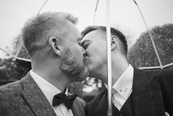 Umbrella Kiss At Gay Wedding Of Rory And Colin Image By Hoult Photography Via Gay Wedding Guide 1 5 344X230
