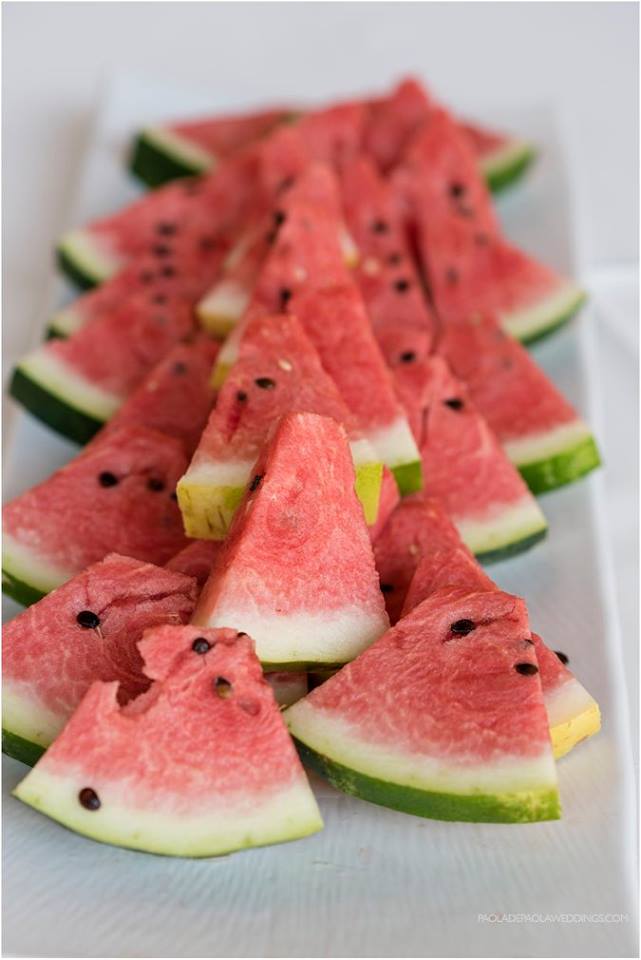 watermelon slices at lesbian destination wedding of Sara and Karen photograph by Paola de Paola Photography 3 5