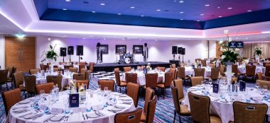 Wedding Arrangement Main Floor With Stage At Front At Oec In Sheffield Via Gay Wedding Guide 9 380X174