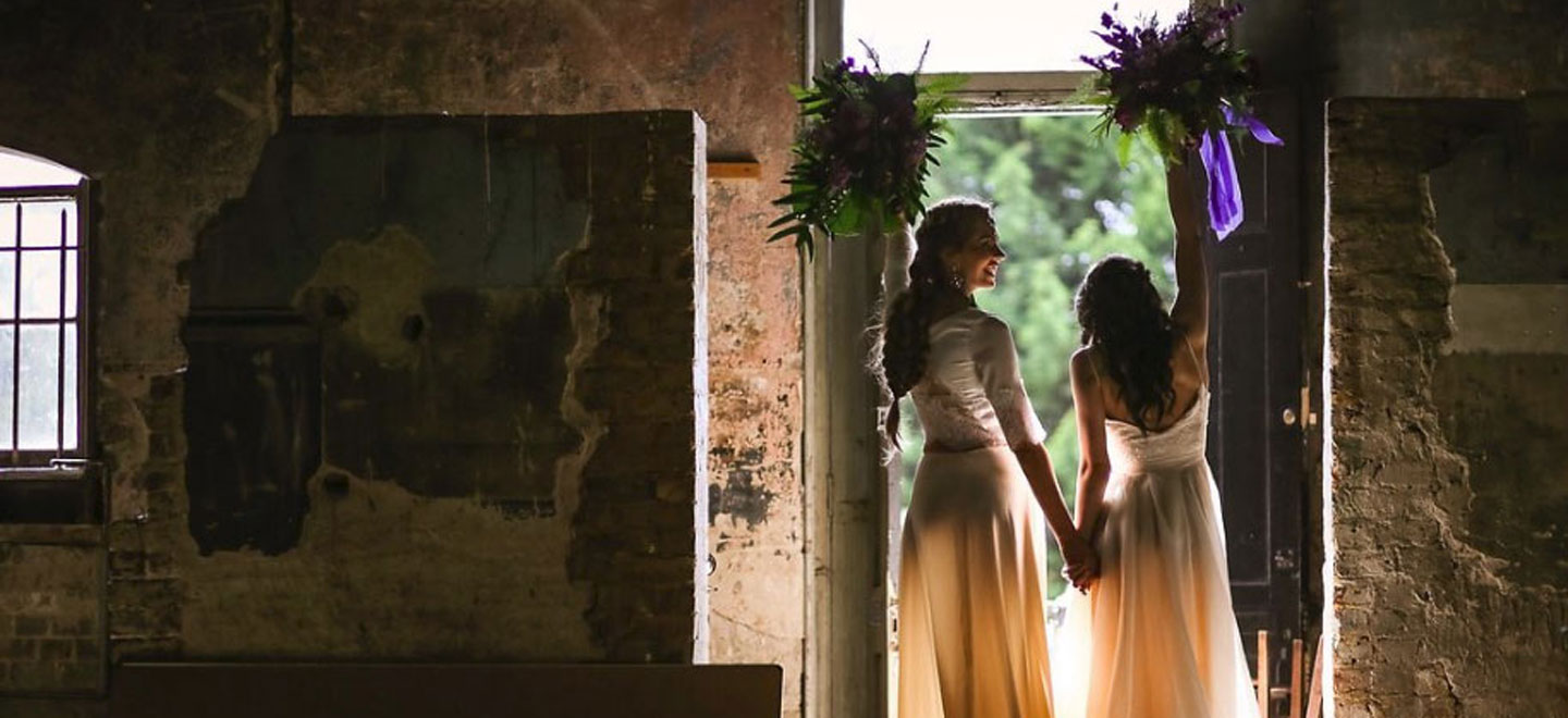 1440 Models as brides holding bouquets up at Gothic and Purple wedding ideas Styled Shoot via The Gay Wedding Guide 1