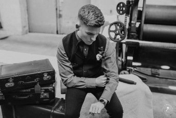 Groom Looks At His Watch At Styled Gay Wedding Shoot At Germany Fabric Factory.1 Image By Juliabartelt 1 5 344X230
