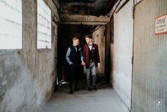 Grooms Hold Hands At Styled Gay Wedding Shoot At Germany Fabric Factory.1 Image By Juliabartelt 1 5 344X230