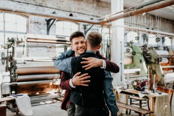 Grooms Hug At Styled Gay Wedding Shoot At Germany Fabric Factory.1 Image By Juliabartelt 1 5 344X230