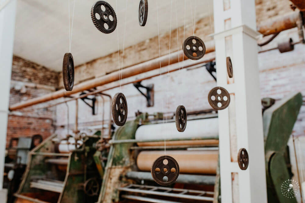 Hanging machinery at styled gay wedding shoot at Germany fabric factory.1 Image by JuliaBartelt 1 5