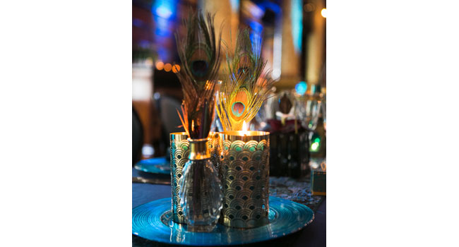 Peacock-feathers-and-votive-at-Gay-Wedding-of-Marc-and-Uday-Peacock-blue-wedding-theme-by-Shiraz-Events-via-the-Gay-Wedding-Guide