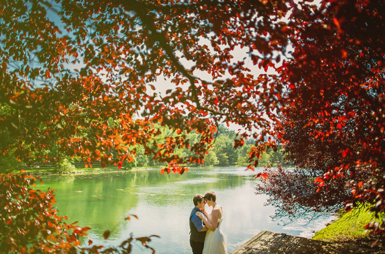 Robyn And Shawnee Stand By Lake In Autumn Best Lesbian Wedding Photos Image Copyright Sam Hurd Photography Via Gay Wedding Guide 2 - Best Gay Wedding Photos By Season: Autumn Robyn And Shawnee Stand By Lake In Autumn Best Lesbian Wedding Photos Image Copyright Sam Hurd Photography Via Gay Wedding Guide 2 - Best Gay Wedding Photos By Season: Autumn Gay Wedding Guide