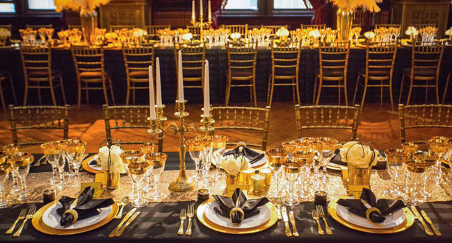 Table-settings-in-gold-and-black-by-Shiraz-events-gay-wedding-planners-uk-and-us