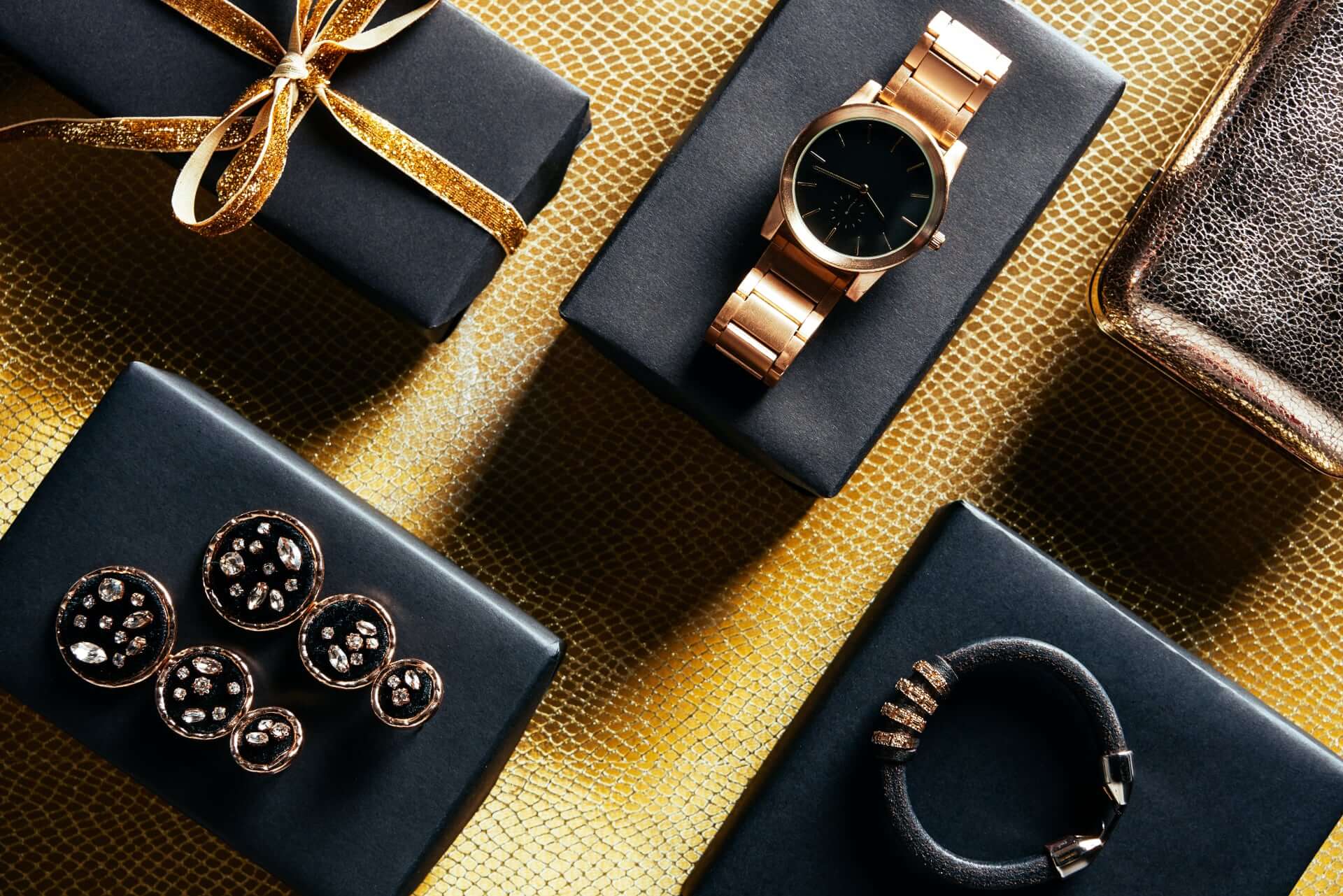 Flat Lay With Wrapped Gift Feminine Jewelry And Pu Xrbzptf 2 - What To Consider When Buying Groomsmen Gifts Flat Lay With Wrapped Gift Feminine Jewelry And Pu Xrbzptf 2 - What To Consider When Buying Groomsmen Gifts Gay Wedding Guide