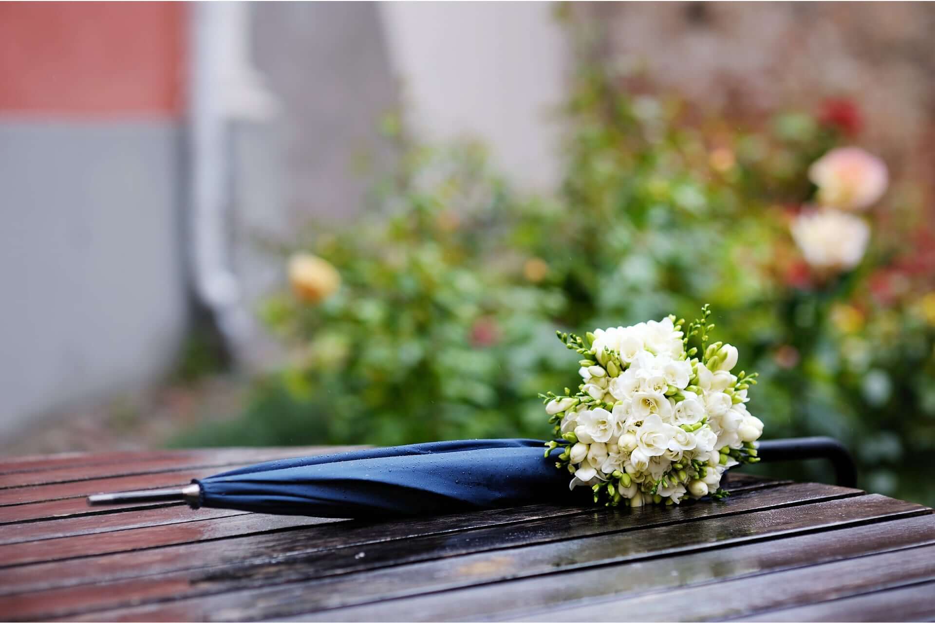 Rainy Wedding Umbrella And Flowers 2 - How To Choose An Elopement Photographer Rainy Wedding Umbrella And Flowers 2 - How To Choose An Elopement Photographer Gay Wedding Guide