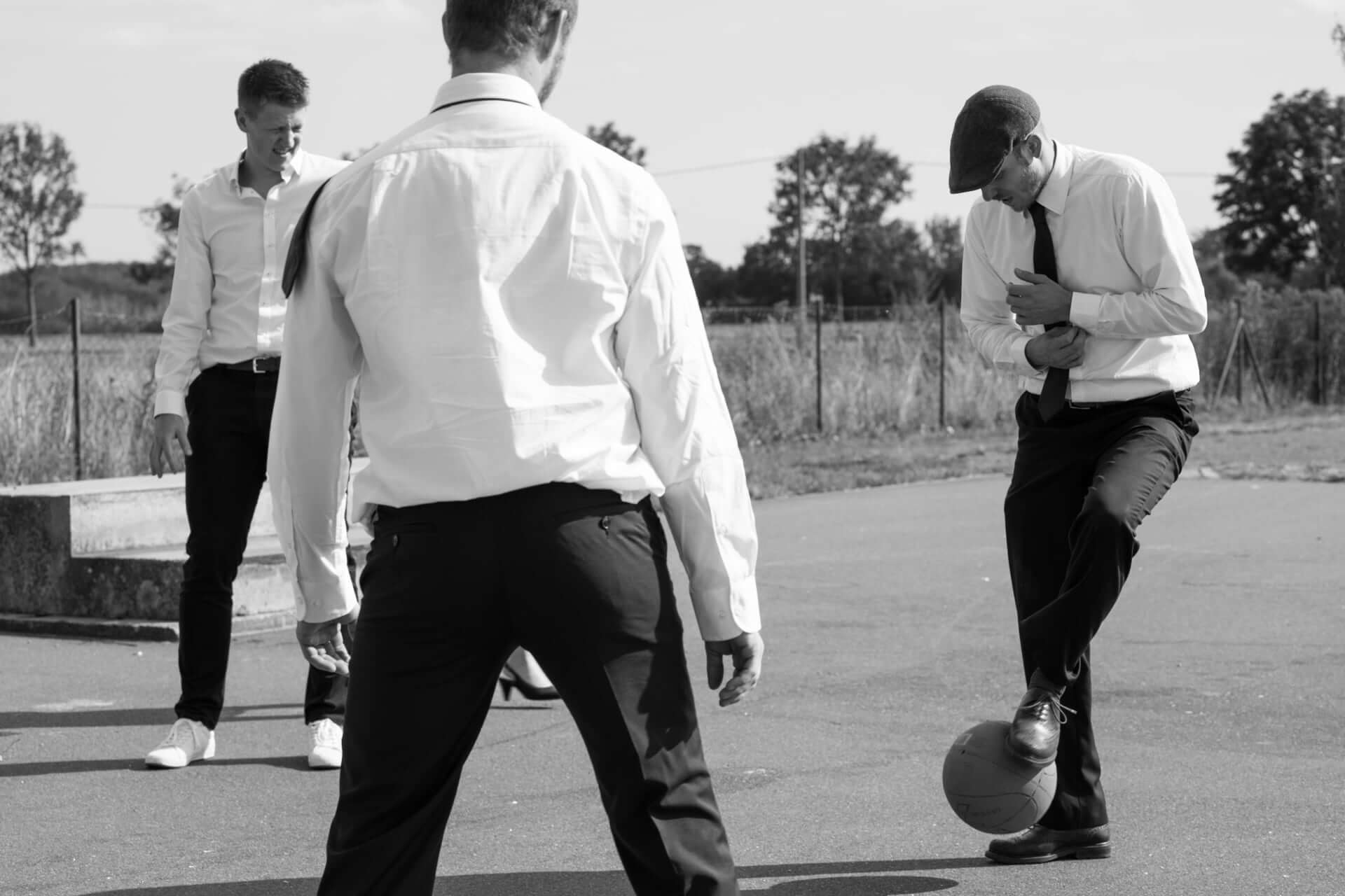 Three Grooms Playing Football - Front Page Gay Wedding Guide