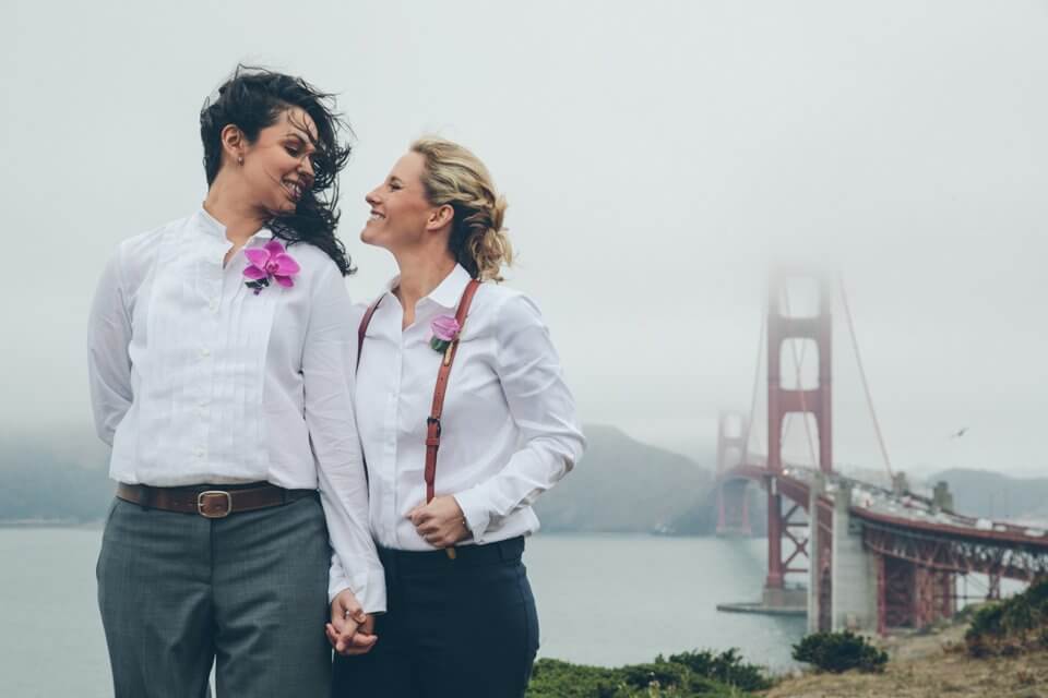 Two Casual Lesbian Brides Walking By Bridge Via Gay Wedding Guide 2 - 30 Amazing Lesbian Wedding Suits To Look Stunning On Your Big Day Two Casual Lesbian Brides Walking By Bridge Via Gay Wedding Guide 2 - 30 Amazing Lesbian Wedding Suits To Look Stunning On Your Big Day Gay Wedding Guide