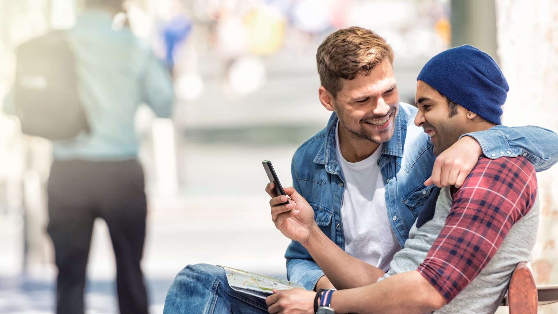 Two Gay Men Sitting On A Bench And Smilling At Each Other 2 - How To Choose An Elopement Photographer Two Gay Men Sitting On A Bench And Smilling At Each Other 2 - How To Choose An Elopement Photographer Gay Wedding Guide