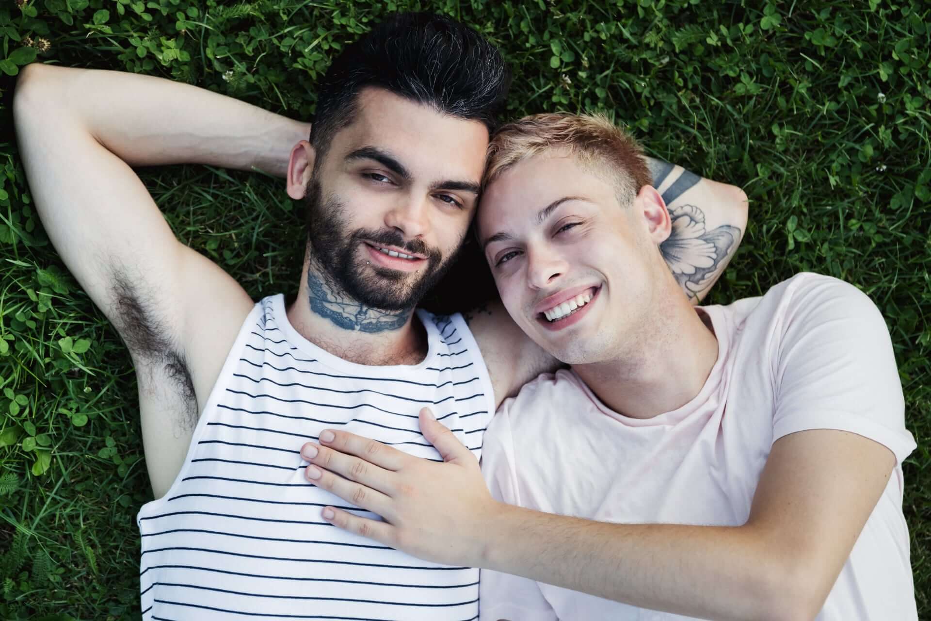 Two Gay Men Sitting On Their Back On The Grass 2 - How To Choose An Elopement Photographer Two Gay Men Sitting On Their Back On The Grass 2 - How To Choose An Elopement Photographer Gay Wedding Guide