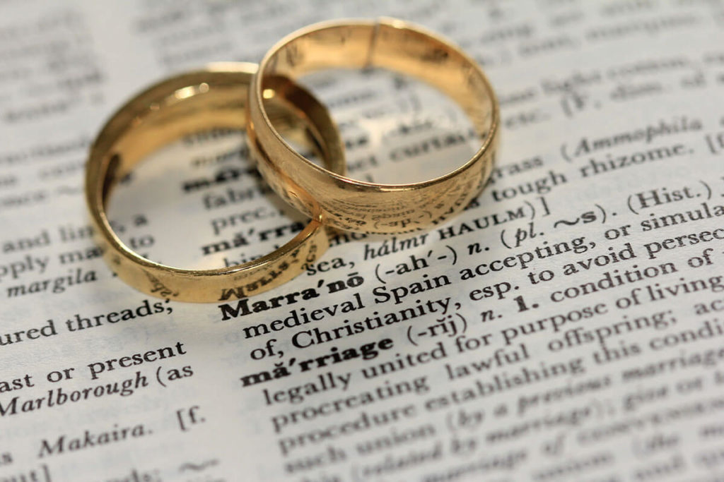 Two Gold Wedding Rings On Paper By Sandy Millar On Unsplash Via Gay Wedding Guide 1024X683 1 2 - 31 Most Beautiful Countries Where Same-Sex Marriage Is Legal (Updated) Countries Where Same-Sex Marriage Is Legal