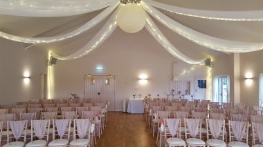 Indoor Ceremony With The Ceiling Drapes